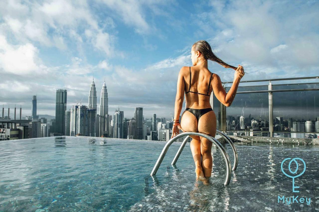 Expressionz Professional Suites By Mykey Kuala Lumpur Exteriör bild A woman wearing a thong bikini